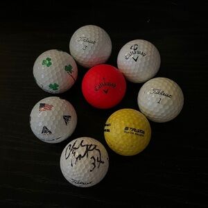 Callaway and Titleist Golf Balls Set + Signed ball? Not sure by who.